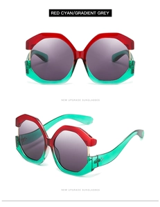 Detail view of red and cyan gradient sunglasses with grey lenses and metal rivets