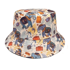 Close-up of elephant and palm tree prints on ivory cotton sun hat for women