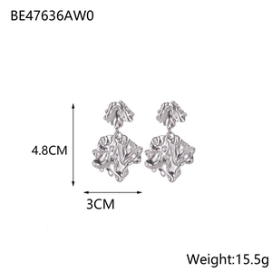 Macro shot of silver irregular leaf earrings showing 4.8cm length and 3cm width details