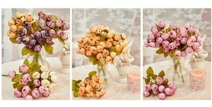 Detail view of multi-head burnt edge silk roses in vintage purple and orange tones