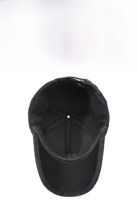 Close-up of winter baseball cap with plush lining and foldable ear flaps for warmth