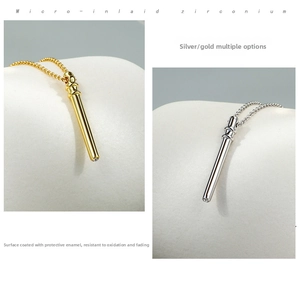 Detail showing gold and silver bamboo bar necklaces with zircon pavé accents