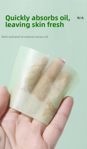 Detailed shot showing high-absorbency facial oil blotting paper clearing excess sebum