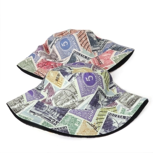 Reversible bucket hat featuring vintage stamp print for outdoor sun protection
