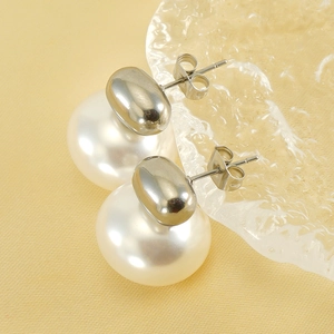 French vintage pearl stud earrings in polished 18K titanium steel with a minimalist design