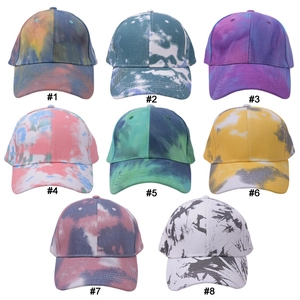 Collection of eight colorful tie-dye baseball caps in various gradient pattern styles