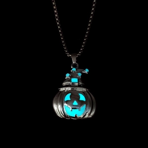 Luminous Halloween pumpkin pendant with wizard hat showing blue glow on black background