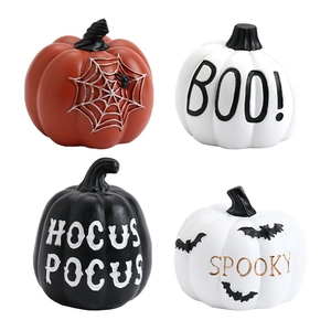 Set of four Halloween resin pumpkins with Boo and Spooky text for tabletop decor