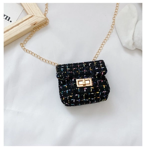 Detailed view of mini tweed crossbody bag with golden chain and metallic twist lock