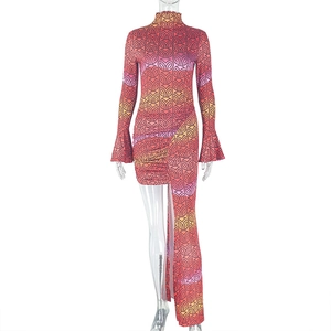 Detail of high neck long sleeve dress with geometric patterns and asymmetrical hemline