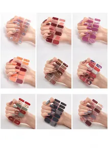 Detail view showing nine distinct 3D laser gold nail sticker designs in various colors