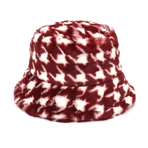 Detail of the soft houndstooth plush fabric on the burgundy winter bucket hat