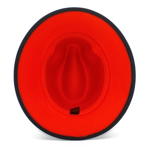 Detail shot of two-tone wool jazz hat interior showing red lining and black wide brim