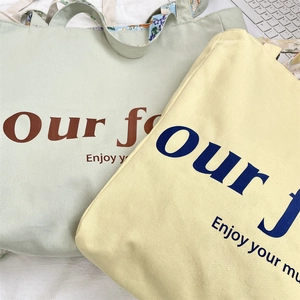 Detail of floral printed lining and durable canvas texture on large tote bags