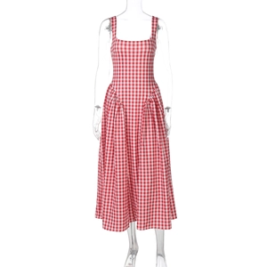 Detail view of the red plaid princess dress showing waist pleats and A-line skirt