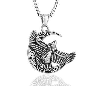 Vintage stainless steel crescent moon and eagle pendant necklace on white background