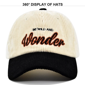 Close-up of 3D 'WONDER' embroidery and fine corduroy texture on the baseball cap