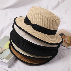 Flat top straw boater hats in multiple colors with black ribbon bow for sun protection
