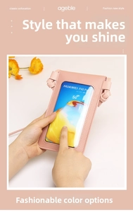 Detail view of pink crossbody phone bag with transparent PVC touch screen window