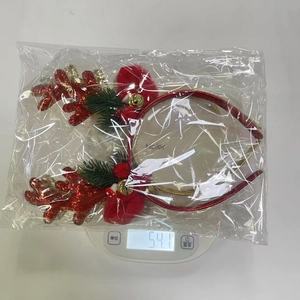 Detailed weight measurement of a glittery red reindeer antler headband with bells