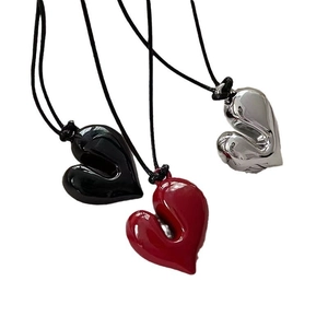 Adjustable heart pendant necklace in red, black and silver on black cord cords