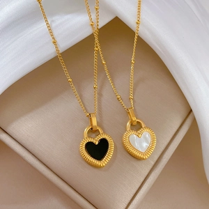 Minimalist gold titanium steel heart pendant necklace featuring shell inlay on silk
