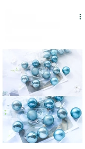 Detailed view of light blue Christmas baubles with matte, mirror, and faceted textures