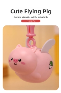 Mechanical pink flying pig toy with white wings and string pull mechanism for kids
