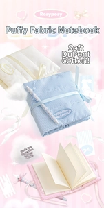 Detail of soft padded puffy notebook covers made of DuPont cotton with ribbon and pen