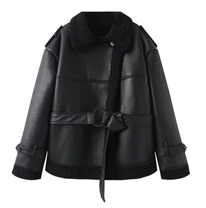 Detail of black faux leather biker jacket with plush shearling collar and waist belt