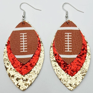 Detailed view of triple-layered faux leather football earrings with red and gold glitter