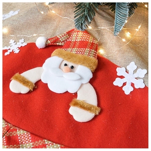 Close-up of 3D Santa Claus applique and plush texture on a burlap Christmas tree skirt