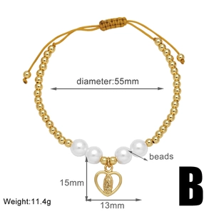 Detail of beaded gold bracelet with virgin mary heart charm and 55mm diameter measurement