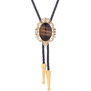 Detailed close-up of tiger eye bolo tie with crown pattern and braided leather cord