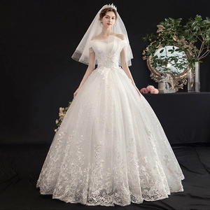 Elegant off-shoulder bridal ball gown with floral lace embroidery and matching pearl veil