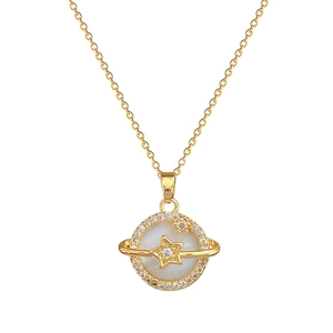 Gold planet necklace with shell center and star pendant on dainty chain