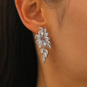 Macro shot of silver cluster earrings with pear-cut cubic zirconia for formal wear