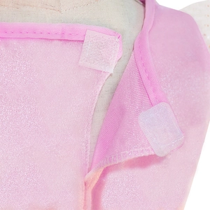 Macro shot of white hook and loop fastener detail on pink glitter unicorn dress fabric