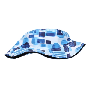Detail shot showing the blue geometric abstract print and stitching on the sun bucket hat