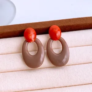 Elegant acrylic oval drop earrings with red marble stud and beige hollow hoop