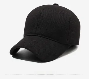 Detail of winter men's wool flat cap with silver lightning logo and warm textured fabric
