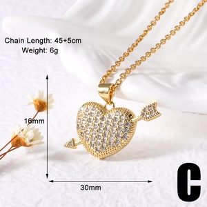 Detail view of gold heart pendant with cubic zirconia and 45+5cm chain dimensions