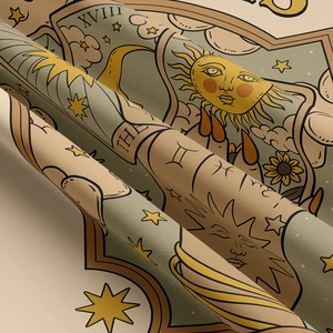 Detail of a tapestry with tarot motifs, including sun, sunflowers and astrology symbols
