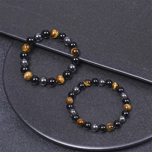 Close-up of 8-10mm tiger eye, hematite and black obsidian beaded energy yoga bracelets