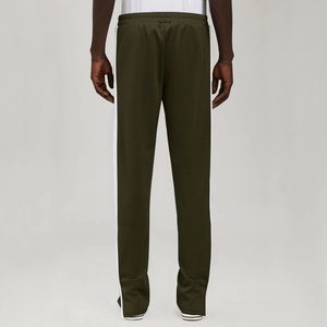 Detail view of olive green joggers featuring dual side stripes and elastic waistband