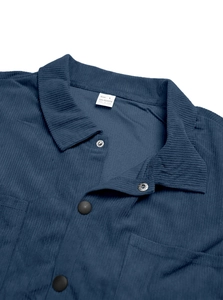 Close-up of navy blue corduroy shirt fabric texture and size L neck label detail