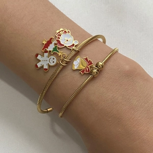 Christmas charm bracelet set with gingerbread man and Santa Claus pendants in gold finish