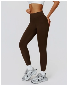 Vertical view of dark brown high-waisted yoga pants with seamless compression fabric for fitness