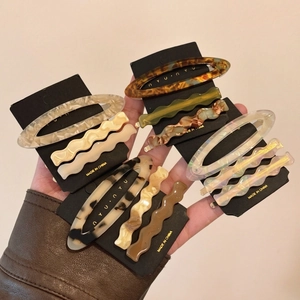 Set of 12 acetate hair clips in marble and tortoiseshell patterns for elegant styling