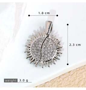 Detail view of 1.8x2.3cm sun-shaped pendant with micro-pave crystals and dimensions